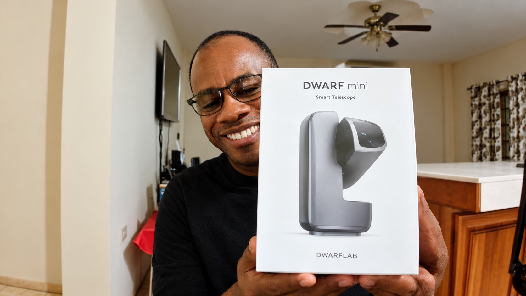 Sherwin Cashie holding the DWARF mini Smart Telescope box during The Digital World interview